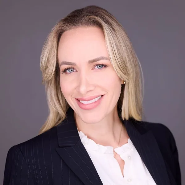 Dr. Sandra Browning smiling in a blue suit