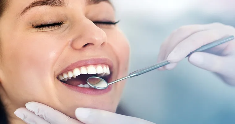 Female patient being examined for veneers.