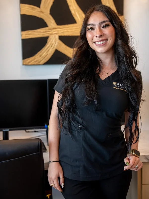 A member of Prizm Dental team smiling